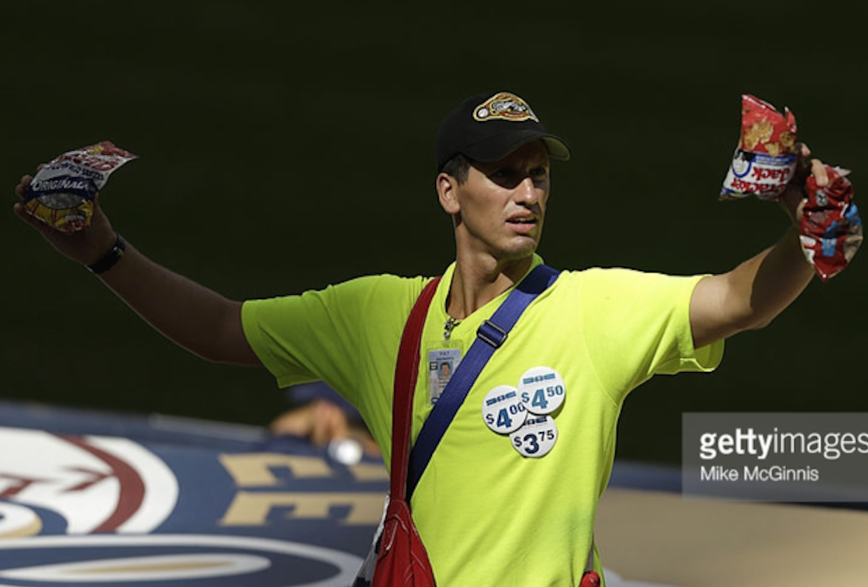 A peanut and Cracker Jack's vendor walks the aisles of Miller Park during a Brewers game last season. Vendors are a critical part of the ballpark's overall entertainment experience. Photo provided by Getty Images