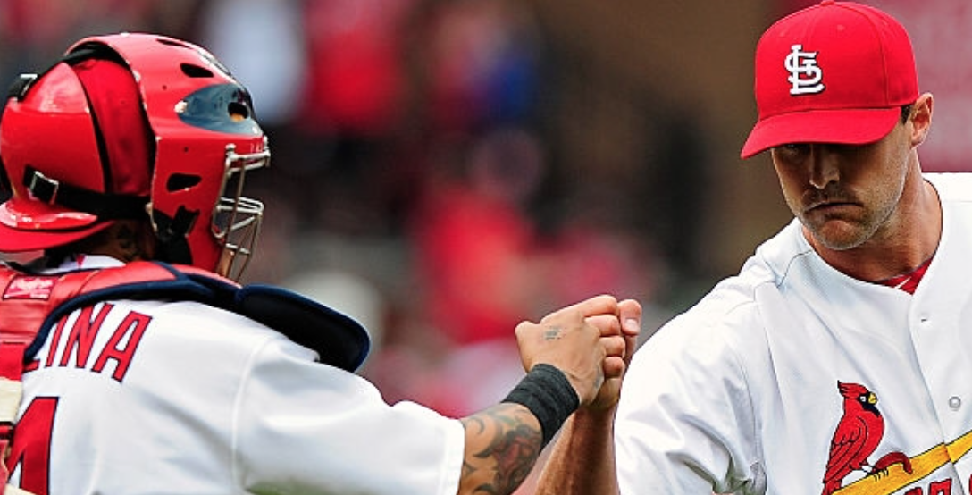 Matt Belisle, Cardinals pitcher, and Yadier Molina, Cardinals catcher, celebrate after the Cardinals defeated the Brewers 4-0 on Thursday in St. Louis. The Cardinals won the series 2-1, sending the Brewers into continued trouble so far this season. Photo provided by Getty Images.