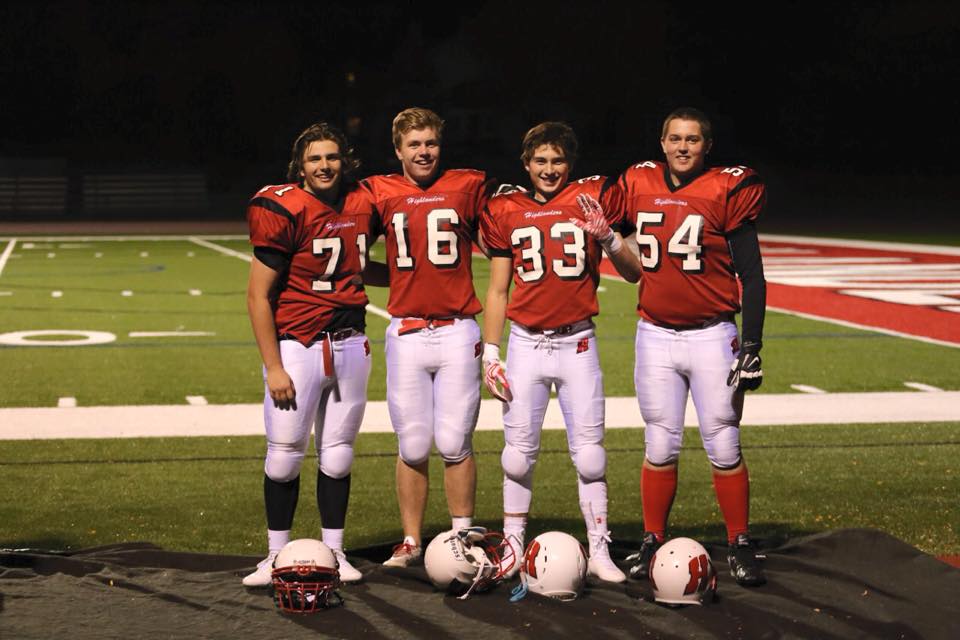 Will Wood (number 71), poses for a picture with his teammates after a Homestead football game.