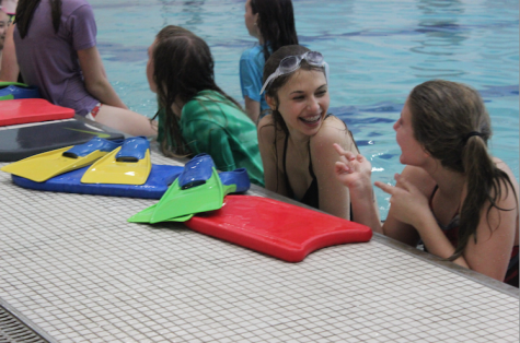 Isabelle Scaffidi, freshman, laughs with her friends during Mr. Dan Benson's Freshman Physical Education class. At first, she was nervous about the swimming unit because she was afraid she would be late to her next class. “We get out at a pretty decent time,” Scaffidi said. 