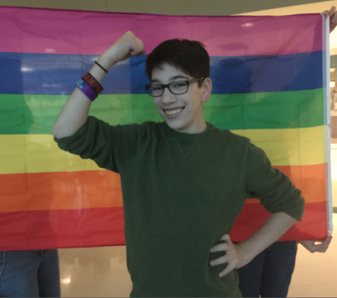 Sam Ginkel, senior and cofounder of the GSA, strikes a pose in front of the club’s rainbow flag. Gathering after the GSA’s discussion of LGBTQ representation in the media on Nov. 13, 2014, various members and the leaders gathered together in the cafeteria to wind down and plan the topics of future meetings. Describing his goals as a leader, he explained, “My goal is to create and help express LGBTQ topics and every other ordinary topic in a perfect blend just so that the GSA can reach a level of normalcy, so that anyone of any sexual orientation or gender identity just feels normal so they can talk about anything normally."