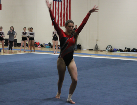 Natalie Ceelen, freshman, sticks her floor routine. Homestead recently took sixth place in its Highlander Invite.