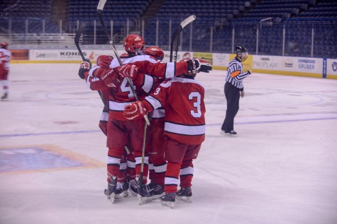A gang of Highlanders celebrate after a goal.  Max Henry, senior, has scored six goals this season. "I've been playing hockey my whole life and it has become a large part of it. With my last year at Homestead, the fear of falling short of our full potential had been inspired by previous seniors and continues to inspire this season," Henry said