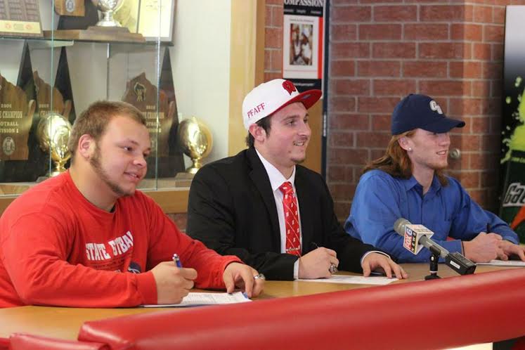 (From left) Elijah Perine, David Pfaff and Nick Ziebell, seniors, signed their National Letters of Intent, committing to a future of collegiate athletics. 