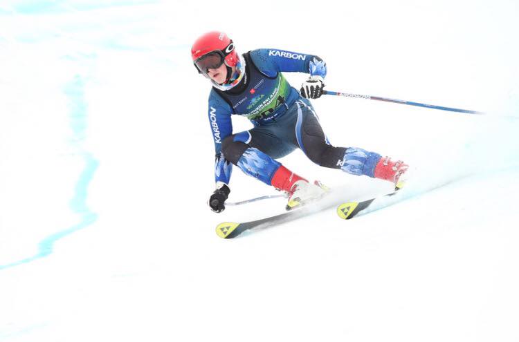 Jake Heilmann, senior, glides down the slopes as he finished in 41st place in State.