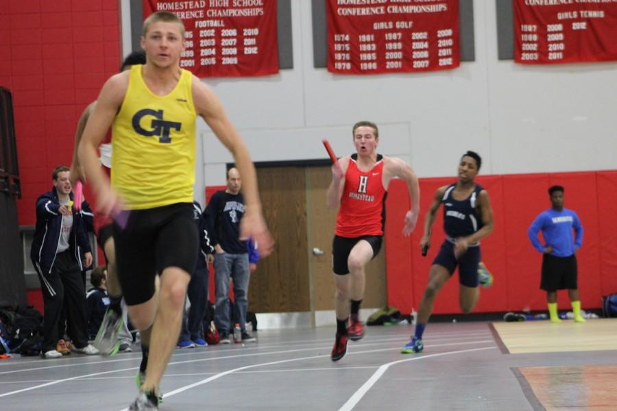 Alex Kocab, junior, competes in the 4 by 100 meter dash.