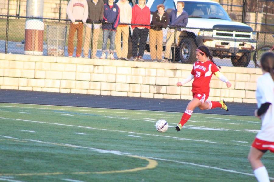 Christine Kerkman, senior, clears the ball out of the defensive zone in a recent game. 