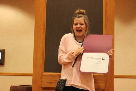 Molly Riebau, junior, shows her excitement after the Highlander Newsmagazine places 8th Best of Show at the 2015 Spring National High School Journalism Convention in Denver, CO. After the news magazine did not place at the Fall National Convention, the staff tweaked some work. “Winning Best of Show as a first year magazine was incredible, and it was great to achieve my goal of placing at the Denver convention,” Riebau said.