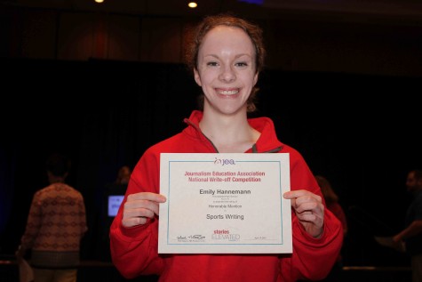 Emily Hannemann, senior, holds her certificate after winning honorable mention in sports writing at the 2015 Spring National High School Journalism Convention. This was Hannemanns first convention and proved successful for the budding writer. “I wasn’t expecting to win anything but was so surprised, thrilled and proud that I did,” Hannemann said.