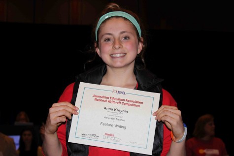  Anna Kreynin, junior, excitedly holds her honorable mention award for feature writing at the 2015 Spring National High School Journalism Convention on Sunday, April 19. Kreynin also won honorable mention for feature writing at the fall convention in Washington DC. “I am happy with my award, but I know what I need to do next time to hopefully win a better one,” Kreynin said.