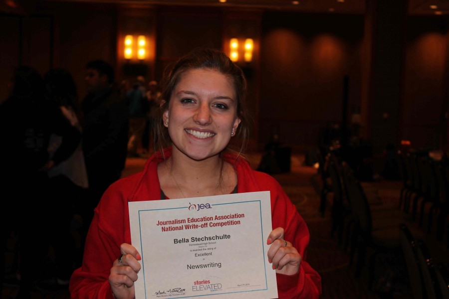 Bella Stechschulte, senior, poses after winning Excellent for feature writing. This was Stechschultes first convention. During the write off I thought I would never win an award because writing the article was so hard. When my name was called I was shocked but also very excited, Stechschulte said.
