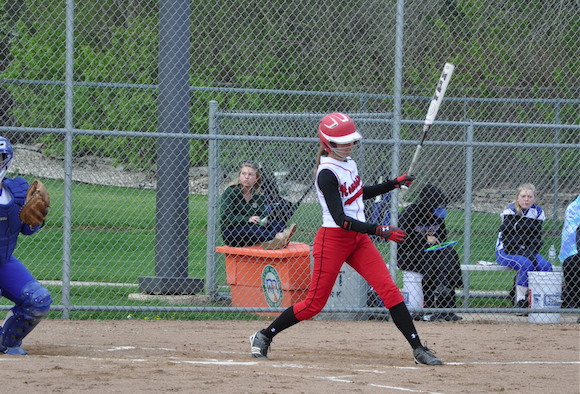 Current senior Hannah Behnken takes a swing during one of last years match-ups.