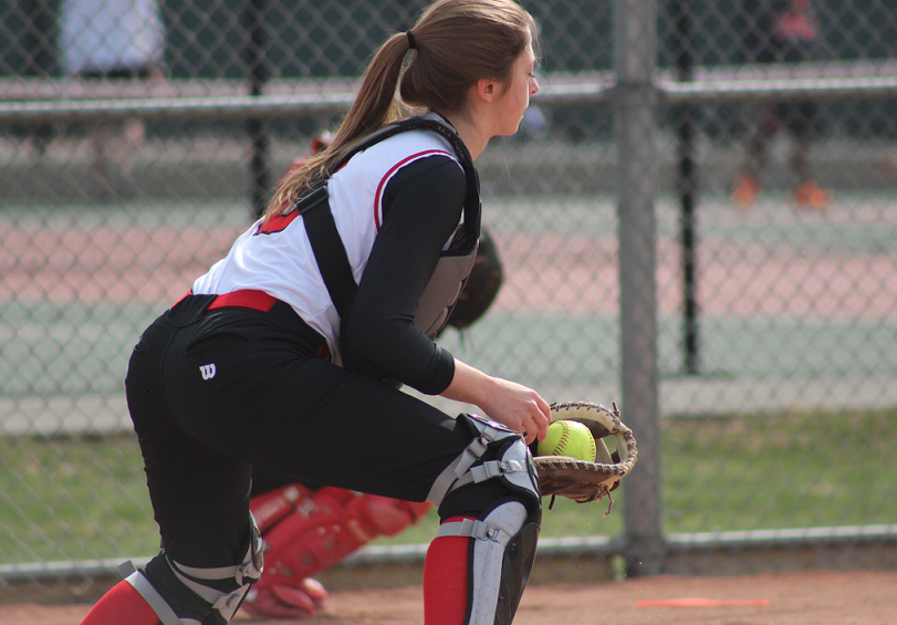 Carly Schulz, senior, catches a pitch during warm-ups on April, 16,  before the win against the Grafton Blackhawks.