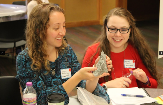 Sarah McCarthy and Kelsey Wagner, seniors, observe a clay molding from one of the mentors at the GEMs event. Wagner stated that the event taught her more about STEM. “Typically when I think of a STEM career, I think of accounting or engineering,” Wagner said. 