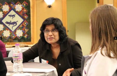 Rashmi Sood, associate professor, discusses her journey to her career to  some high school kids at the GEMs event. Priya Khullar, senior, stated that all the women there were inspiring. “Everyone I talked to was passionate about their job,” Khullar said. 