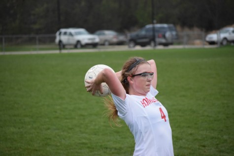 Lauren Padget, junior, distributes a throw in during a recent game against Cedarburg. 