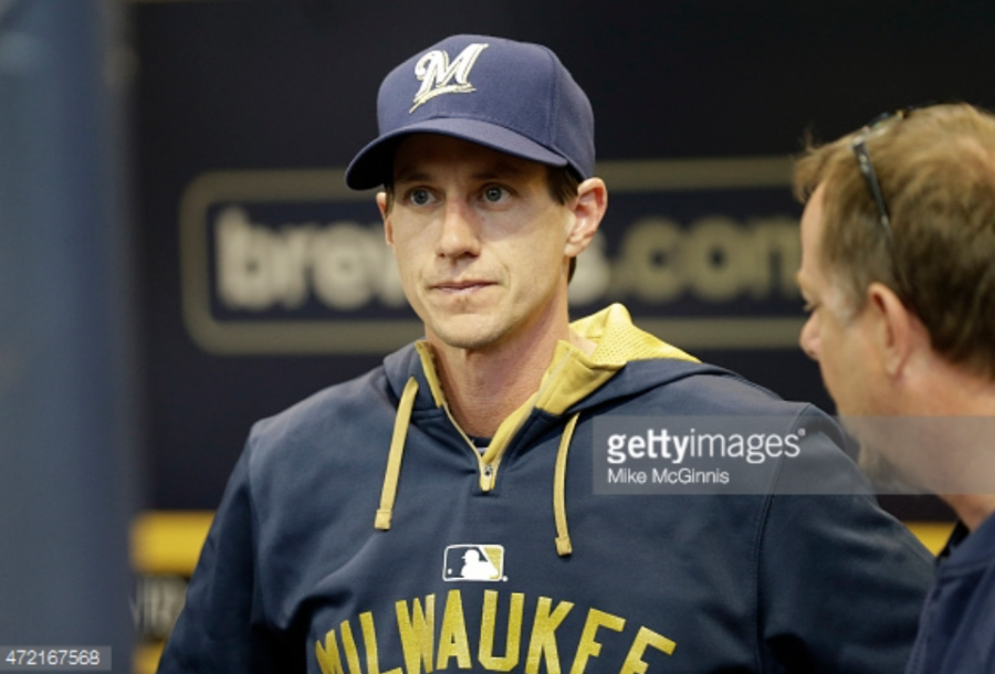 Craig Counsell, the newly appointed manager of the Milwaukee Brewers, stands in the dugout watching his team on Monday night. The Brewers are 2-2 so far in the Counsell era. Photo provided by Getty Images.