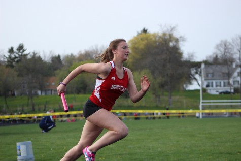 Savannah Melan, freshman, competes in the 4x200 meter relay,