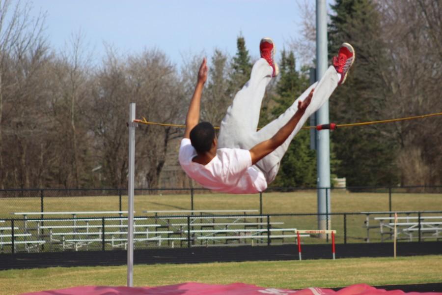 Triggs spends time perfecting his form at practice.  Practice for a high jumper usually entails normal jumping over a cord or jumping with a spring board.