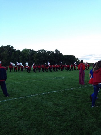 The Homestead Band practices their routine in front of the tailgaters, pumping them up for the game to start.