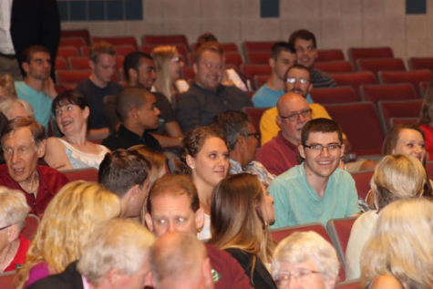 Audience members await the start of Thursday's town hall meeting at the Todd Wehr Auditorium at CUW.
