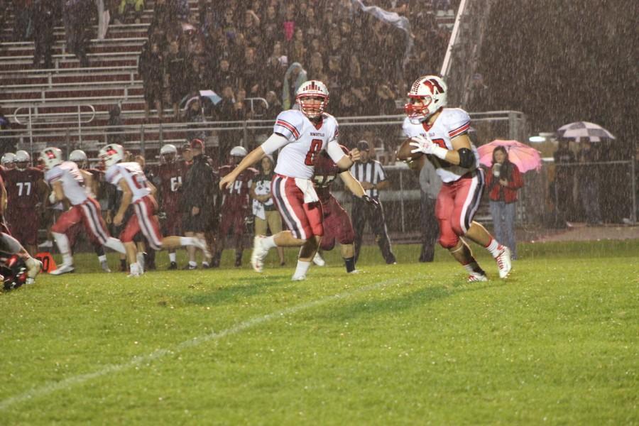 Eric Zoeller, junior quarteback, pitches the ball to Matt Winters, senior running back, in the victory against Milwaukee Lutheran on Friday, Sept. 18.