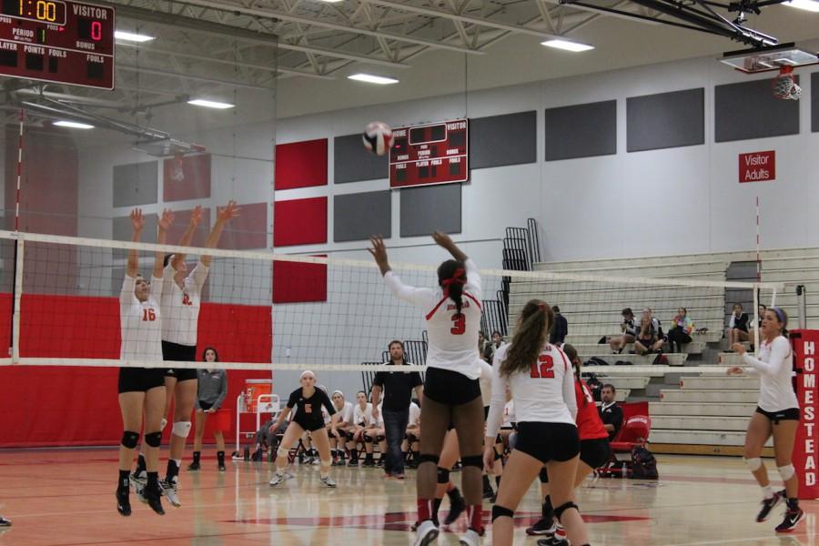 Alexis Silver, senior, goes up for a block against Cedarburg.