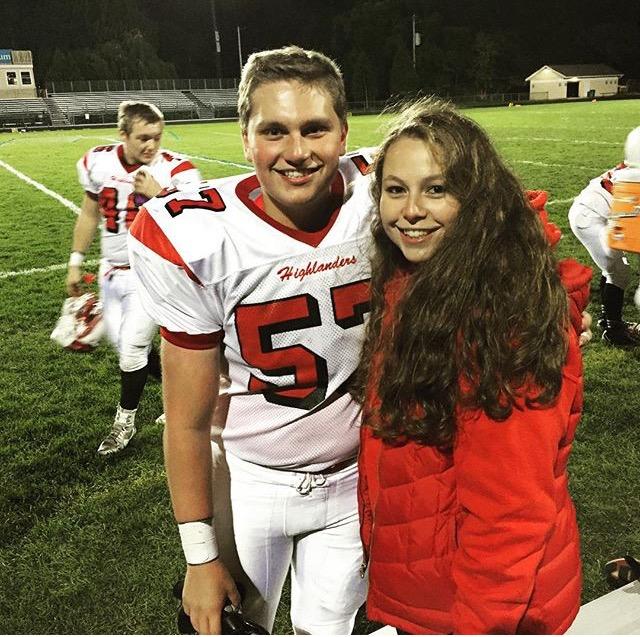 Drew pauses for a picture with Kelsey after the Homecoming game.