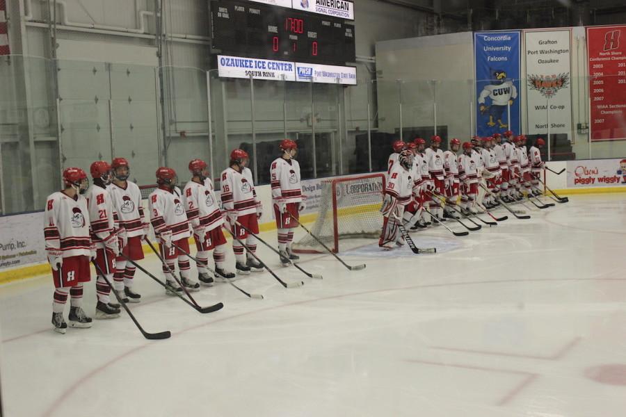 Homestead lines up at the start of the game vs. the Brookfield Catholic Memorial Stars. After the Star Spangled Banner was played the guys skated over to their positions. “I am very proud of our team this season. We are a close knit band of brothers that love to be around each other and can pick each other up whenever we need,” Jake Elchert, senior, said. 