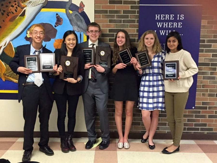Homestead debate team shows all of their plaques from their state competition. Submitted photo