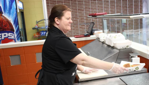 Donna Laughlin, member of Homestead’s lunch staff, prepares sandwiches for students.