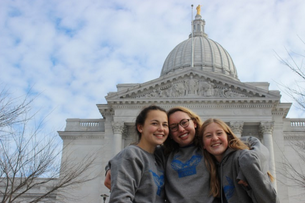 (From left) Alex Van Grunsven, Ansley Laev and Mary Weitzer, juniors, smile in front of the Capitol at National Latin Convention in Madison.