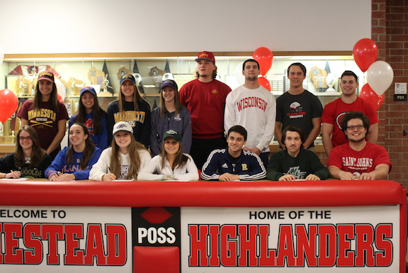 All of the 2016 signing Homestead athletes stand together on national signing day. 