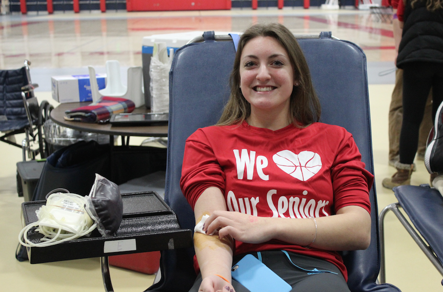 Savanna Melan, sophomore smiles after donating blood. 
