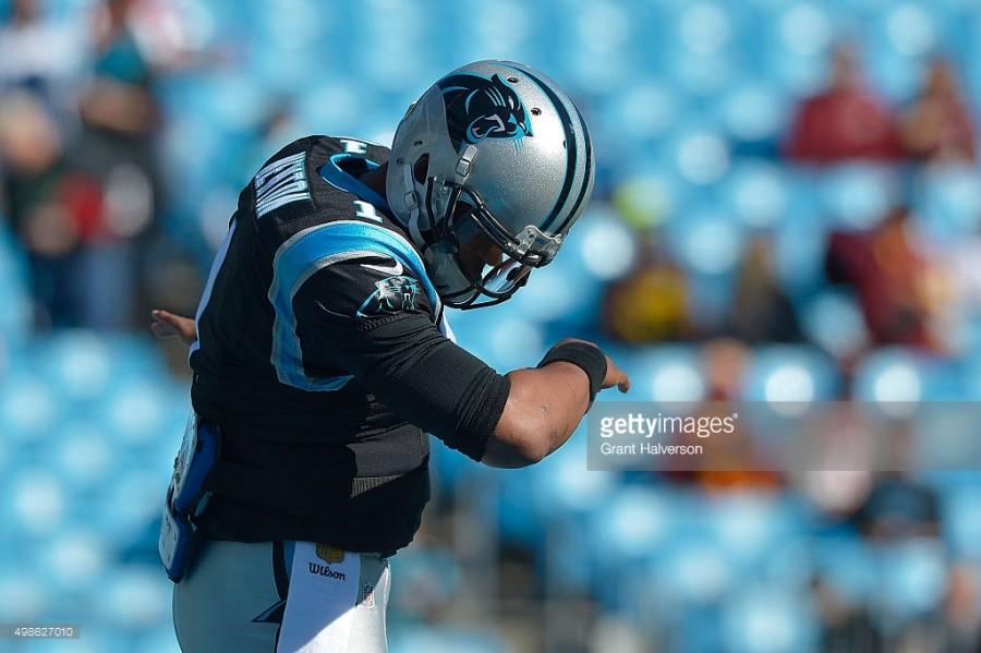 Cam Newton, Carolina Panthers quarterback, celebrates a touchdown by dabbing.