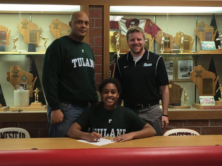 Alexis Silver, senior, poses with her father and Alex Uhan, her club coach, as she signs her NLI to join Tulane Universitys Division I volleyball team in the Fall.
Alexis is one of the toughest competitors I have ever coached. She comes to the gym everyday to work hard on improving her game. She is also a great teammate. She always gets others to laugh and she has a smile so big it can light up the room with energy, Uhan said.