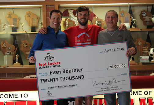 Evan Routhier, senior, poses with coaches Bosley and Claussen and his scholarship check. 