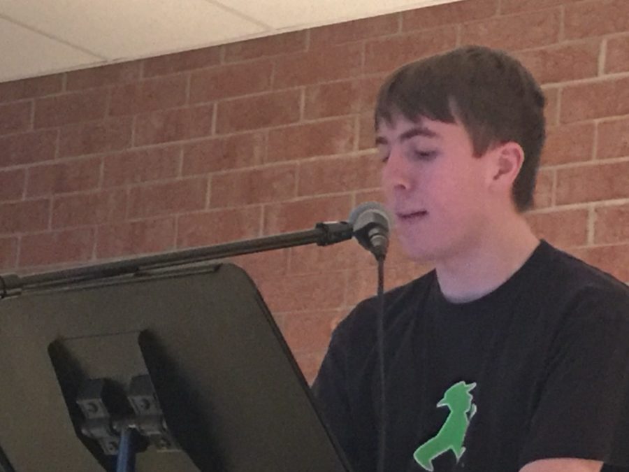 Conlin Steinert, senior, performs a spoken word titled Who Are We? at HHS Unplugged. Steinert wrote the piece a day before the event during his first hour creative writing class. My poem was all based on the line, Steinert said. I started with that line, and then it went from there. 