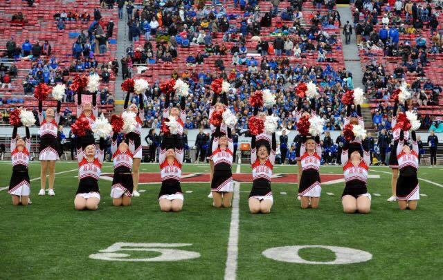 The HHS dance team performs at a football game.