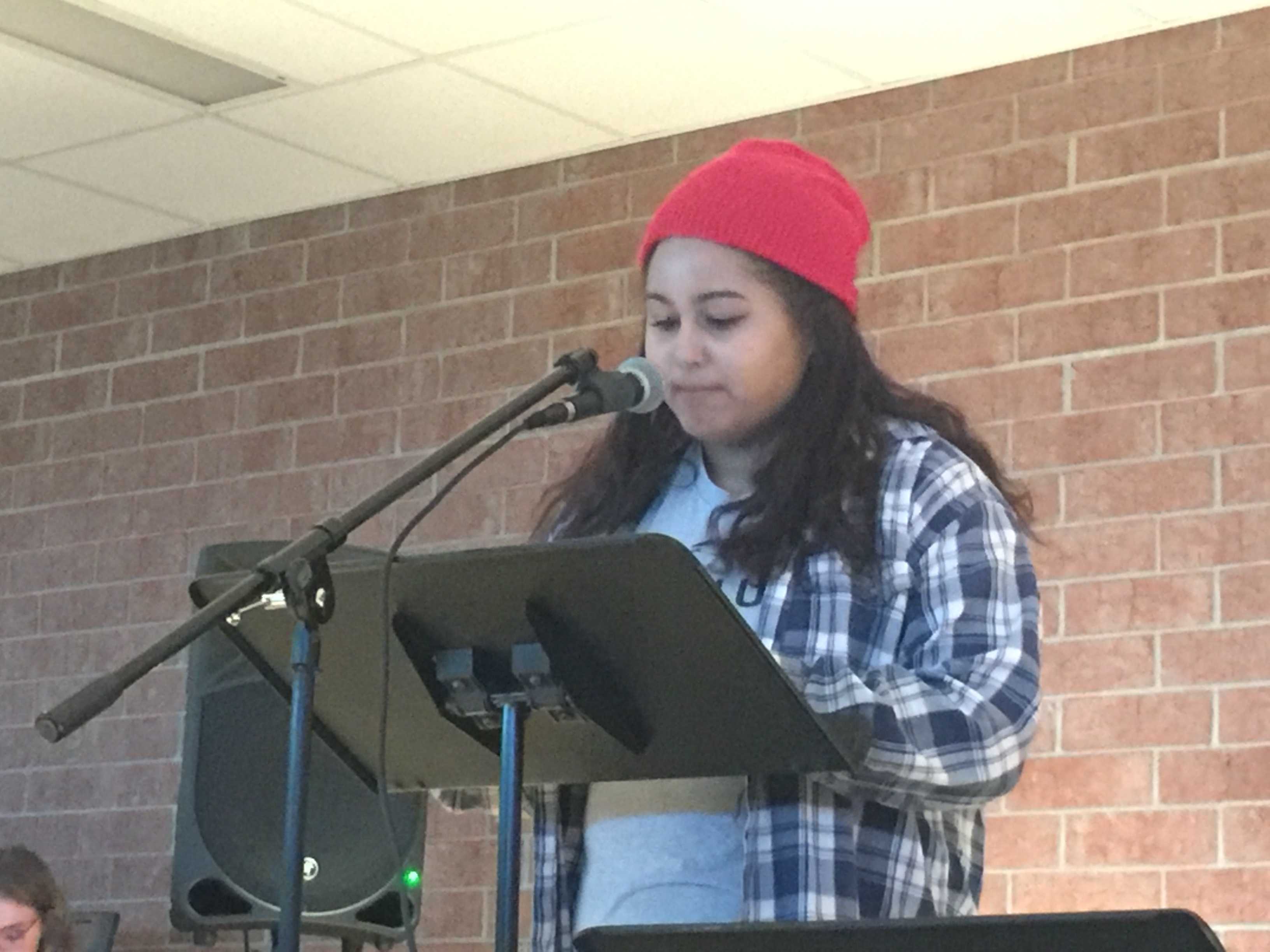 Teighlor McGee, alumni from the Class of 2015 and rising sophomore at St. Catherine University, performs a spoken word at HHS Unplugged. McGee presented this piece at Minnesota SLAM, a poetry competition, and received third place. "It's a really personal piece for me," McGee said. 