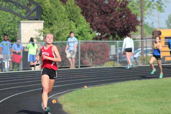 Zanelle Willemse, sophomore, runs in her 4 by 800 relay at Nicolet High School.
