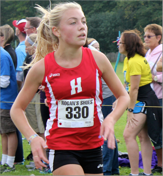 Zanelle Willemse, junior, runs during a varsity cross country race. Willemse started running in varsity cross country races her freshman year. “I remember driving and all of a sudden the Homestead Track Team runs by. It was so different for me to see that because in South Africa we don’t have teams, Willemse said.