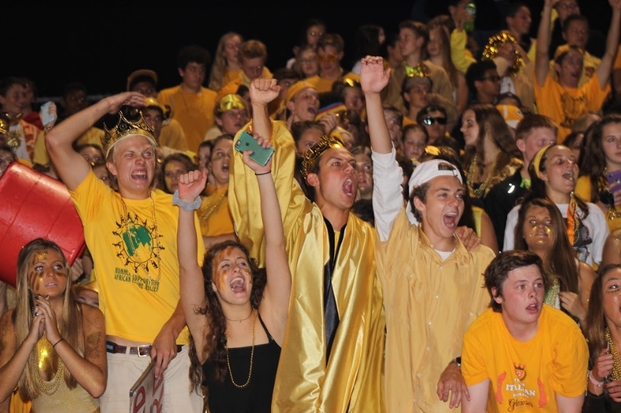 The student section cheers on the football team. The student section decked out in gold to help support childhood cancer awareness. Gold was a really cool theme because it was really unique from any other theme done before and it helps support a good cause, Ellie Sileno, senior, said. 