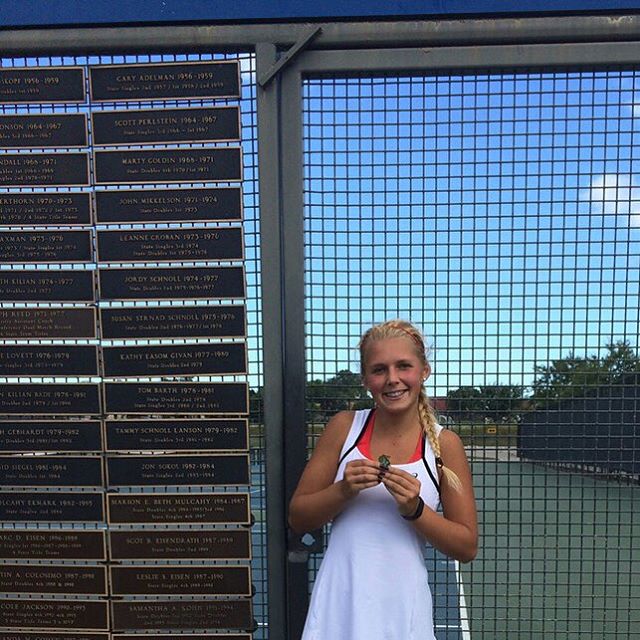 Mikhailenko poses for a picture after winning the singles Sweet Sixteen Championship.