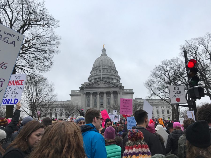 Advocates for womens rights attend the march at the state capitol in Madison, Wis. 