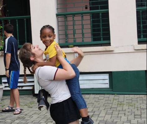 While in Jamaica, Murphy plays with one of the young kids.