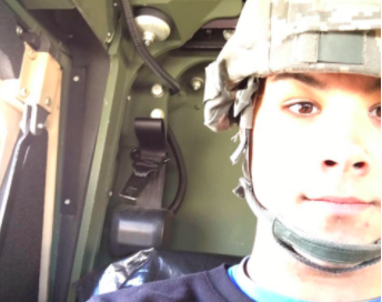 LaBelle sits in a Humvee after running a PM (Performance Maintenance) check.