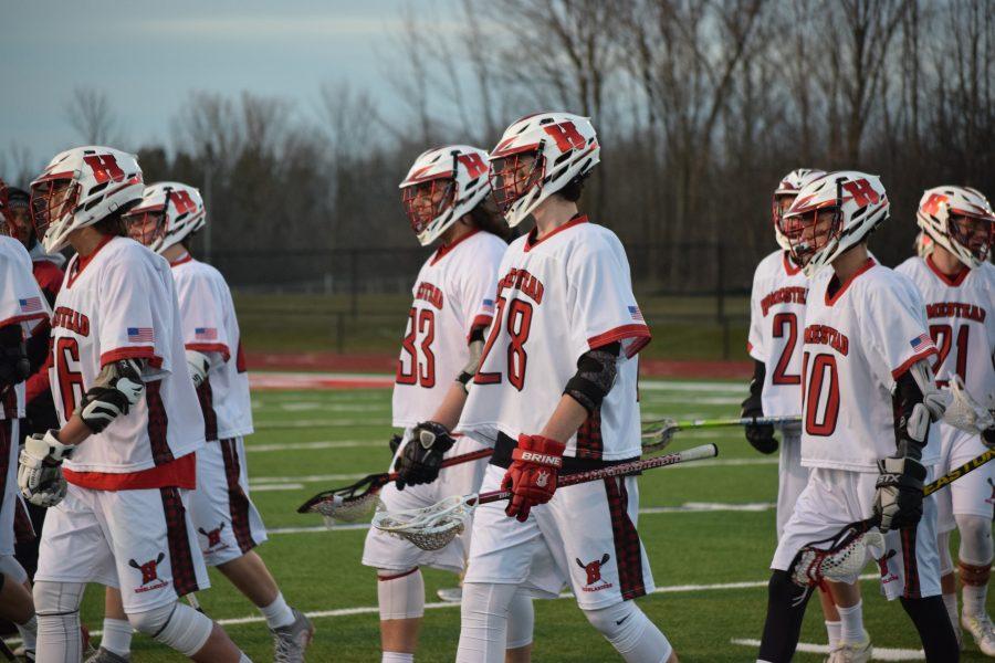 Members+of+Homestead%E2%80%99s+boys+lacrosse+team+march+off+the+field.+