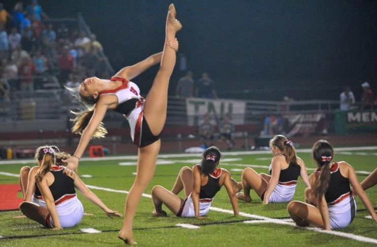 Anna Greisch, freshman, shows off her skills at a dance team halftime performance.