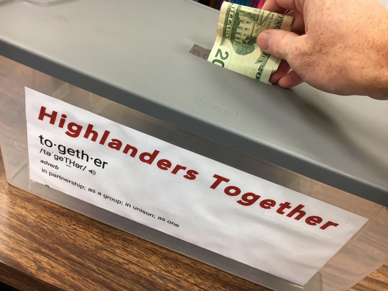Mr. Brett Bowers, principal, donates to the Highlanders Together campaign.